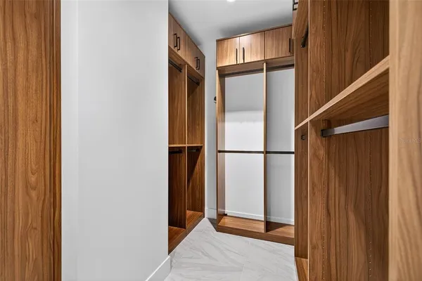 a bedroom with a bed and a table