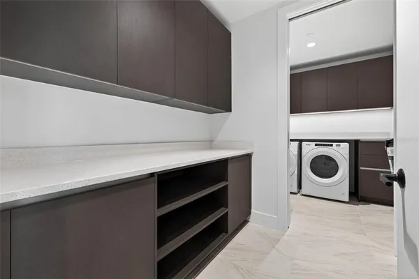 an outdoor space with swimming pool and furniture