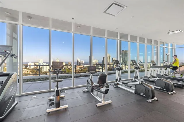 a view of a patio with dining table and chairs with wooden floor