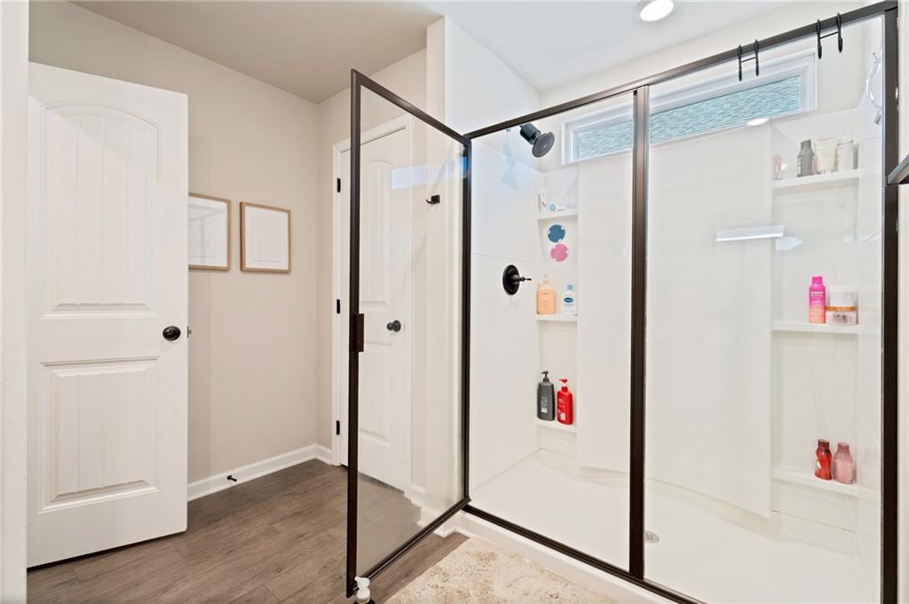 4740 Rdg Vly Drive Gainesville, GA 30504 - Photo 13 of 20 a white room with wooden floor and white walls