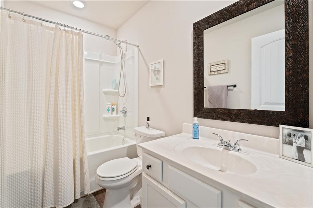 4740 Rdg Vly Drive Gainesville, GA 30504 - Photo 16 of 20 a bathroom with a sink toilet and shower