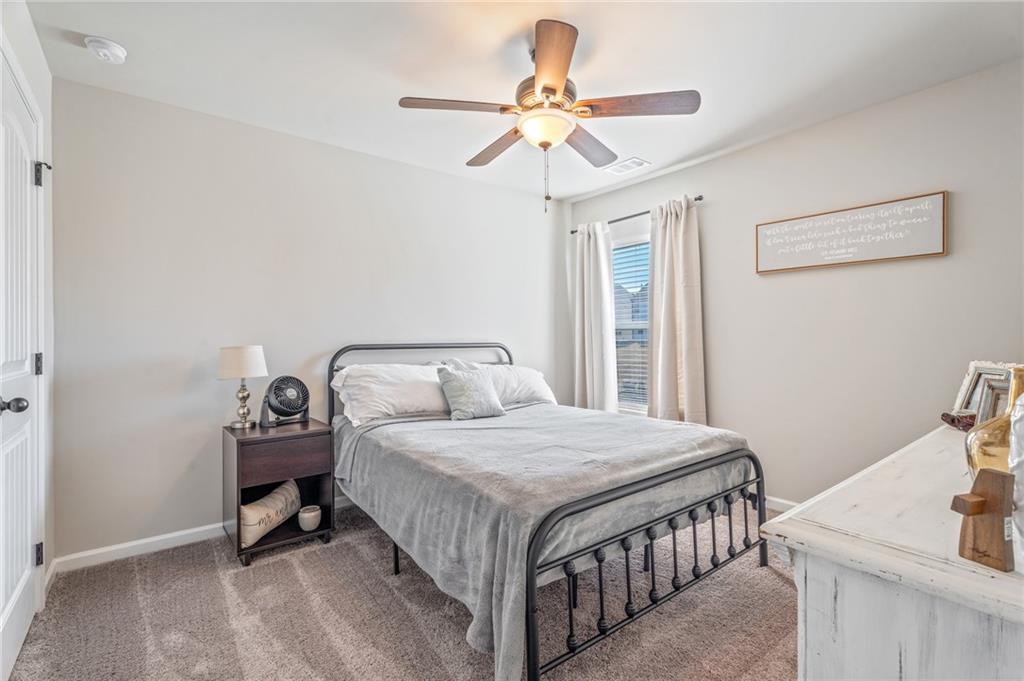 4740 Rdg Vly Drive Gainesville, GA 30504 - Photo 17 of 20 a bedroom with a bed and a chandelier