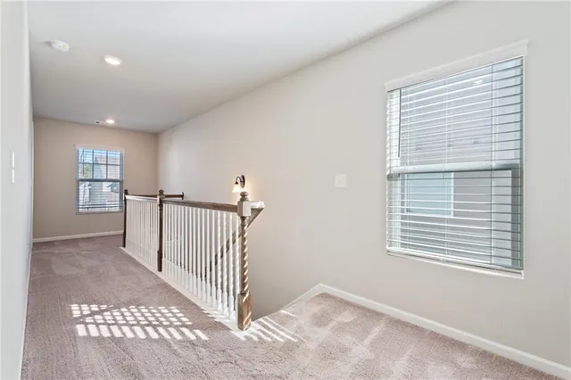 a view of a hallway with windows