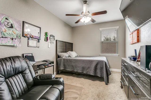 a bedroom with furniture and a chandelier