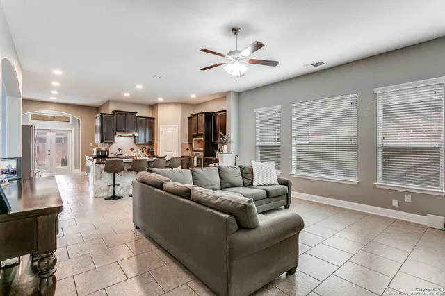 a living room with furniture and a large window