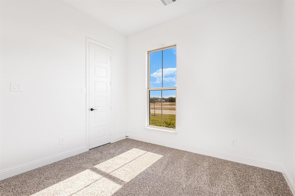 6841 Hayes Road Midlothian, TX 76065 - Photo 19 of 27 a view of an empty room with a window