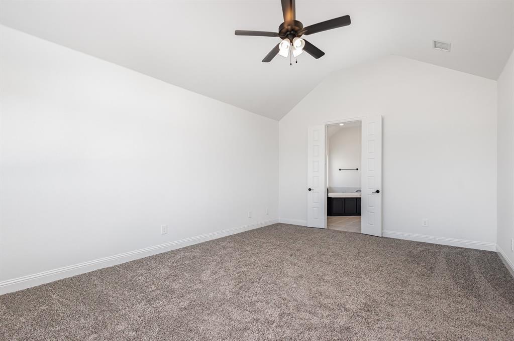 6841 Hayes Road Midlothian, TX 76065 - Photo 25 of 27 an empty room with a empty space and a ceiling fan