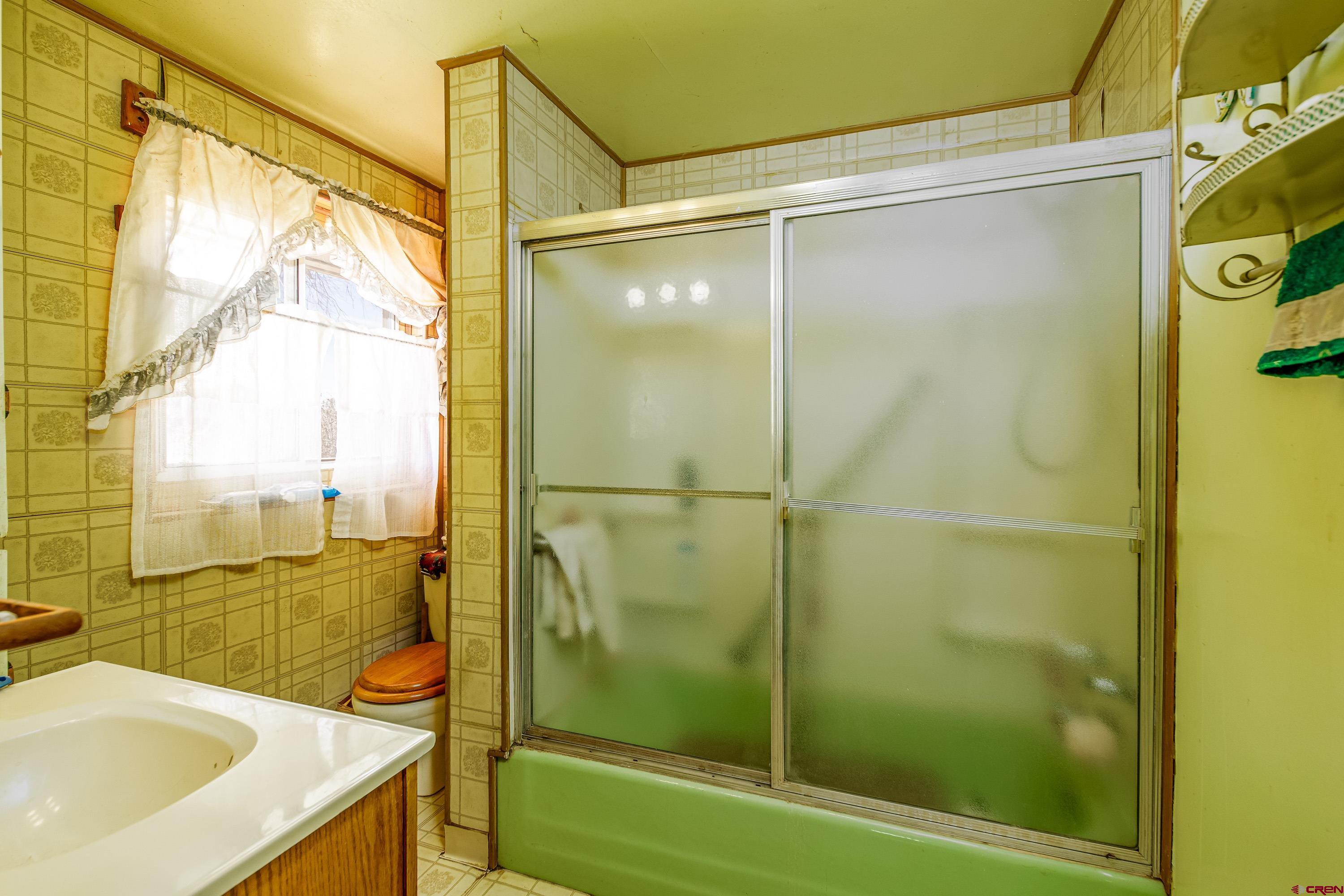 1449 Highway 50 Delta, CO 81416 - Photo 27 of 37 a bathroom with a shower and a sink