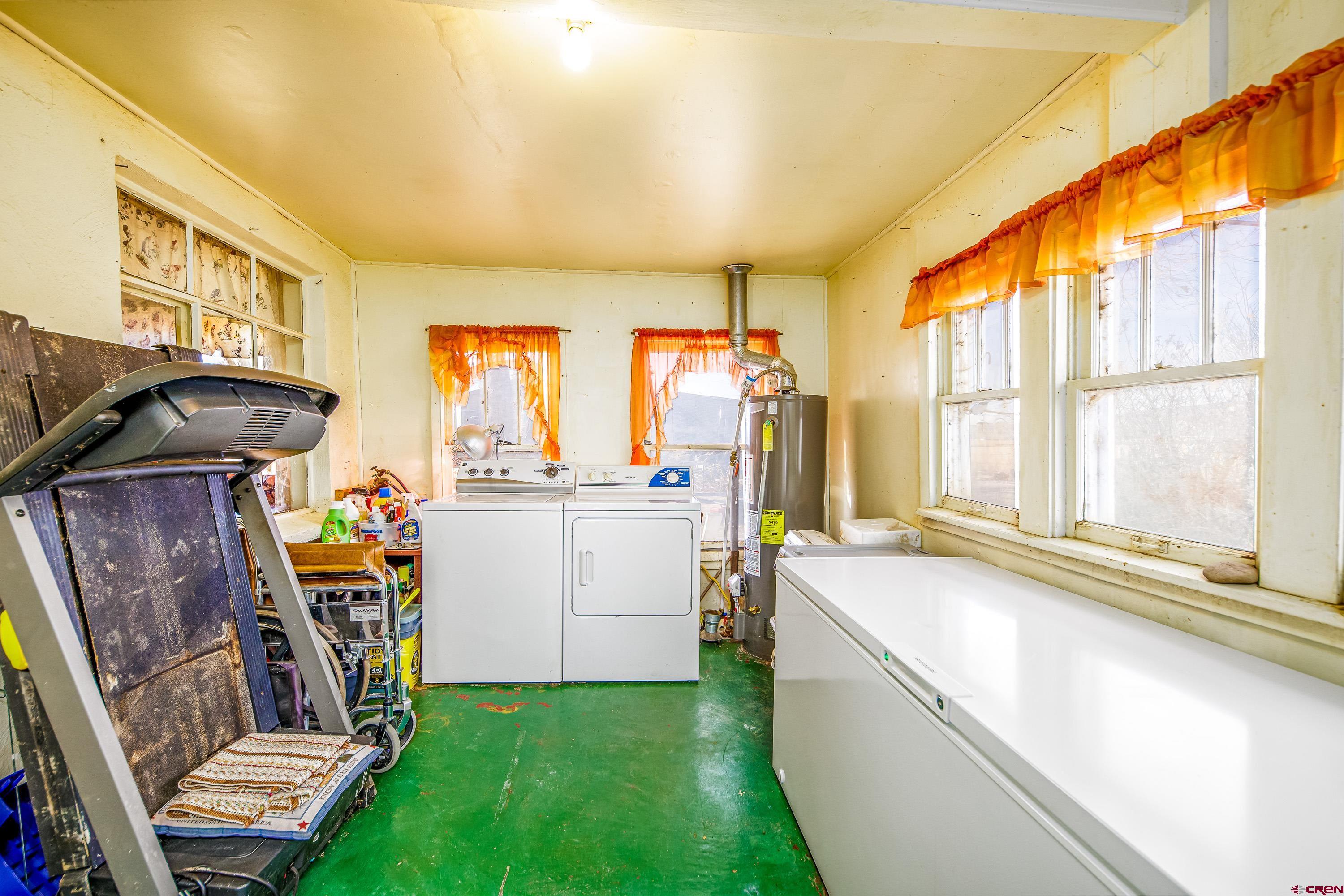 1449 Highway 50 Delta, CO 81416 - Photo 28 of 37 a view of a storage & utility room with washer and dryer