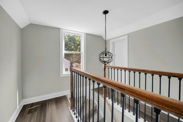 a view of a hallway with windows
