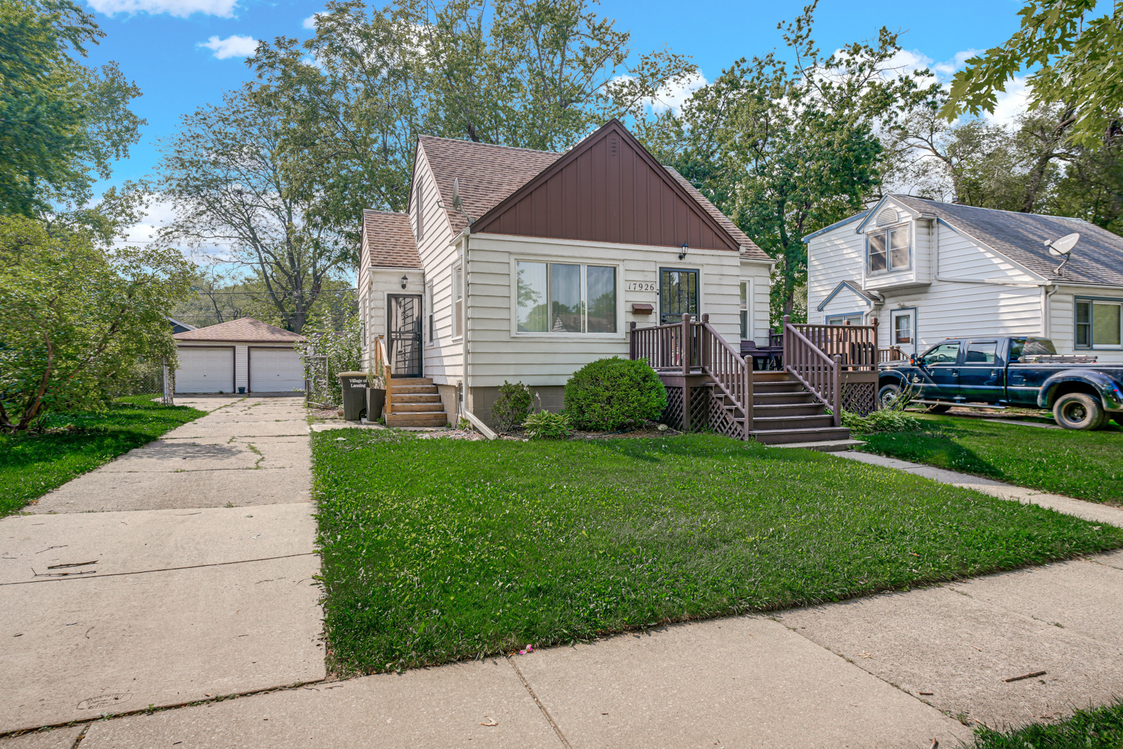 17926 Roy Street Lansing, IL 60438 - Photo 4 of 26 a front view of a house with a garden and plants