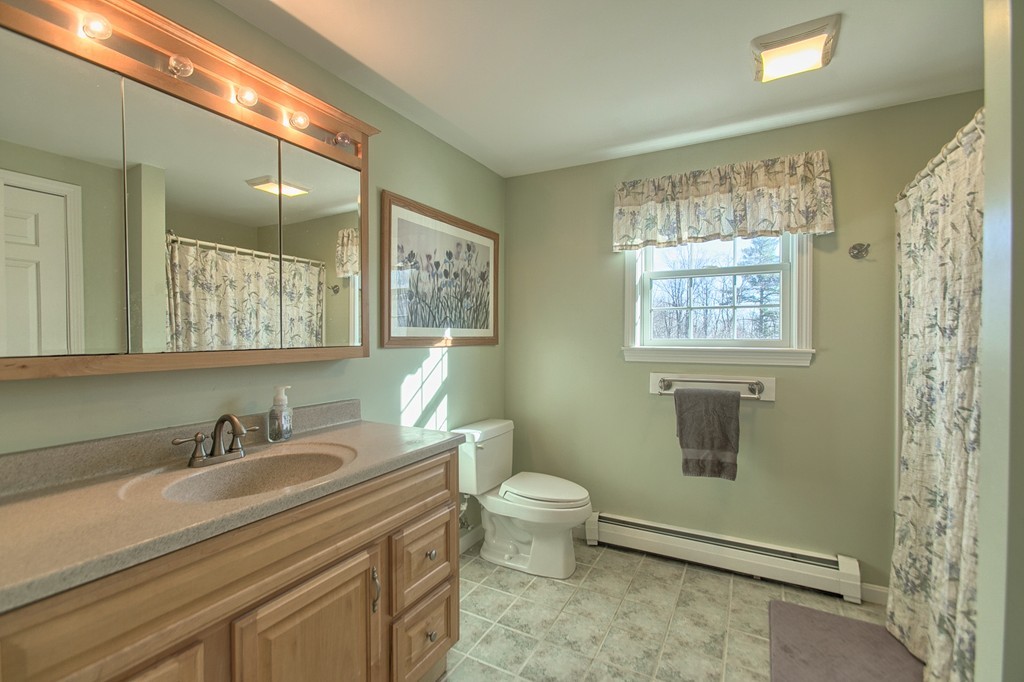 112 Beaman Road Princeton, MA 01541 - Photo 16 of 30 a bathroom with a granite countertop sink toilet and shower