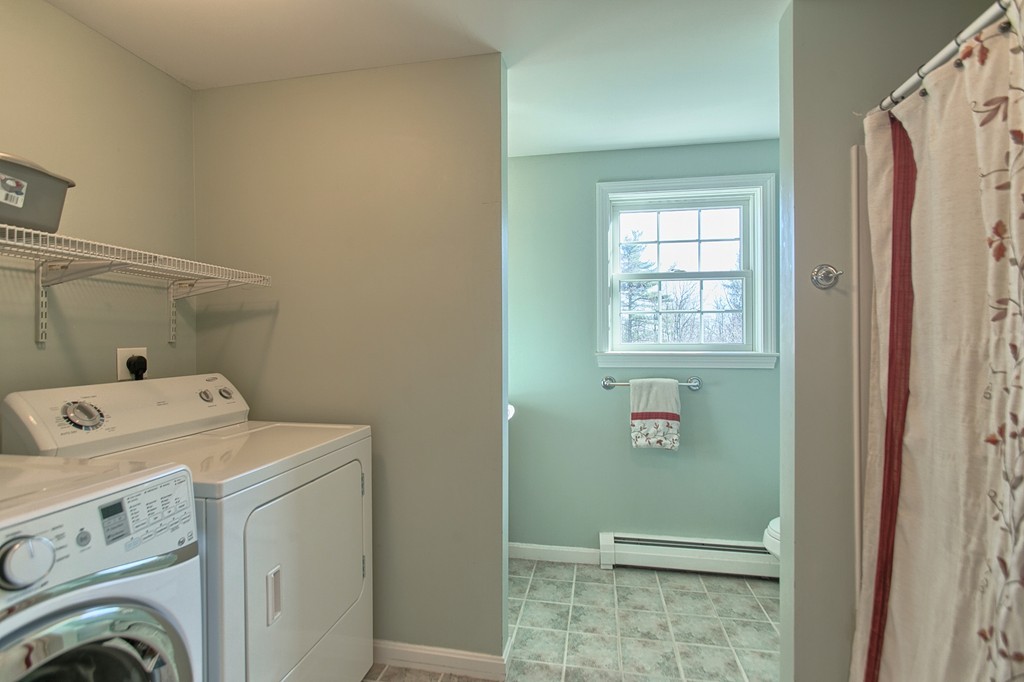 112 Beaman Road Princeton, MA 01541 - Photo 17 of 30 a view of storage and utility room with washer and dryer