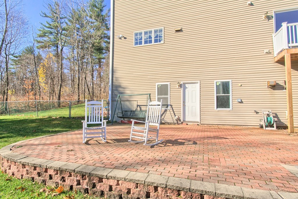 112 Beaman Road Princeton, MA 01541 - Photo 23 of 30 a backyard of a house with barbeque oven table and chairs