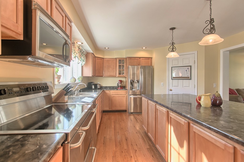 112 Beaman Road Princeton, MA 01541 - Photo 7 of 30 a large kitchen with kitchen island a large counter top space a sink and stainless steel appliances