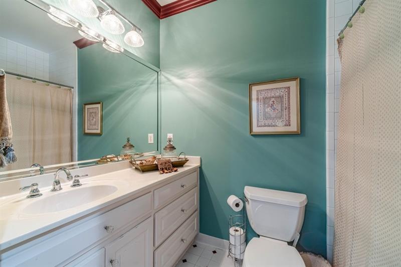 200 Johnson Road Suwanee, GA 30024 - Photo 31 of 71 a bathroom with a toilet sink and mirror