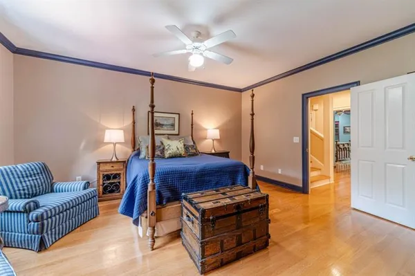 a living room with furniture gym equipment and a chandelier