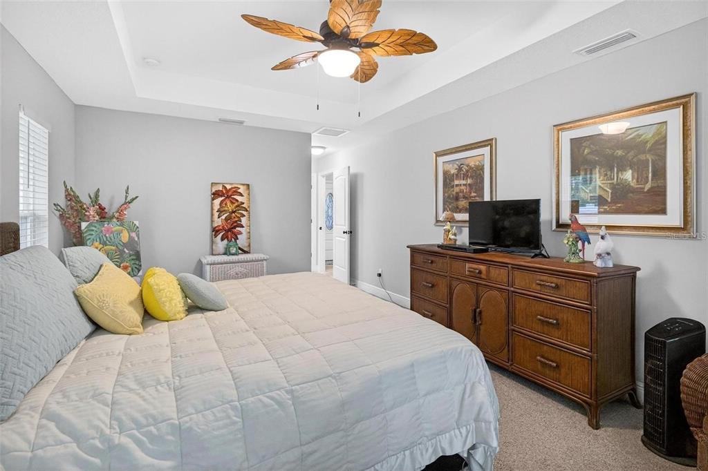 8160 Southeast 164th Place Summerfield, FL 34491 - Photo 27 of 56 a bedroom with a bed and ceiling fan