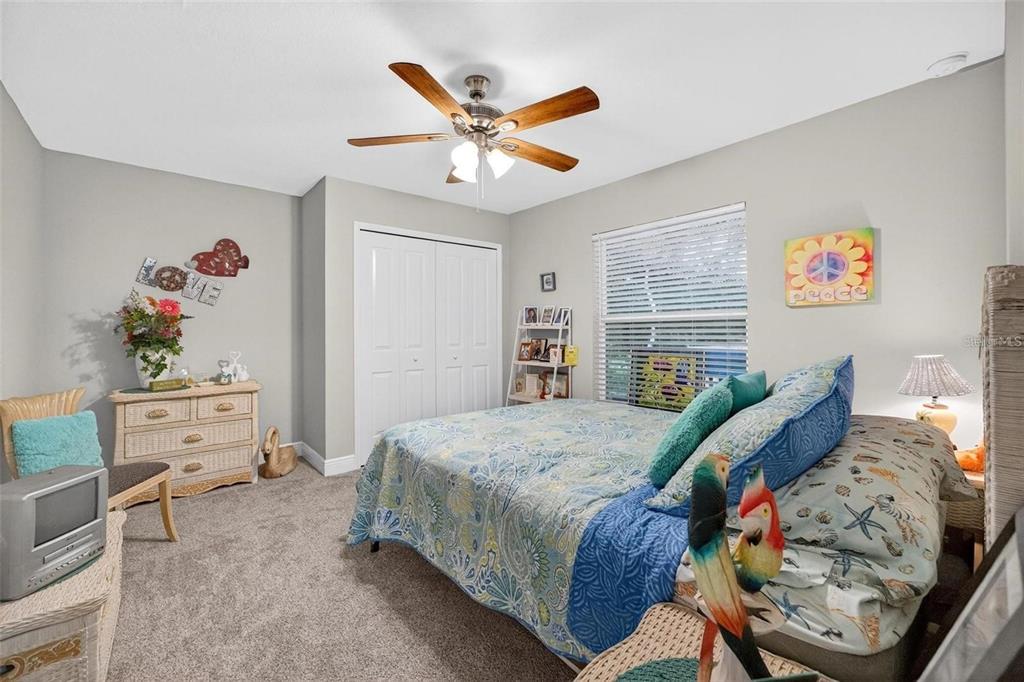 8160 Southeast 164th Place Summerfield, FL 34491 - Photo 35 of 56 a bedroom with a bed and furniture