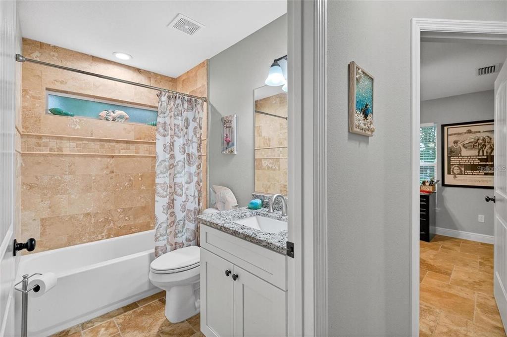 8160 Southeast 164th Place Summerfield, FL 34491 - Photo 38 of 56 a bathroom with a granite countertop sink toilet and shower