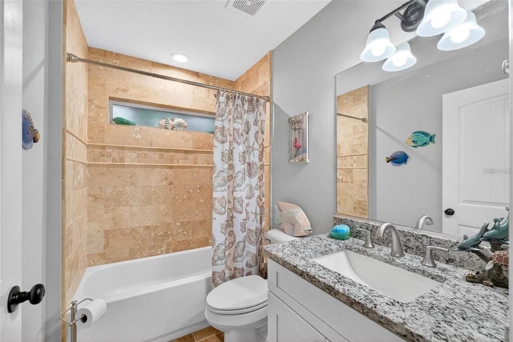 8160 Southeast 164th Place Summerfield, FL 34491 - Photo 39 of 56 a bathroom with a granite countertop sink a toilet and shower