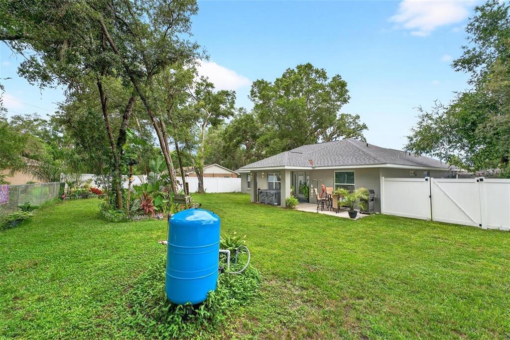 8160 Southeast 164th Place Summerfield, FL 34491 - Photo 44 of 56 a view of a house with a yard and a garden