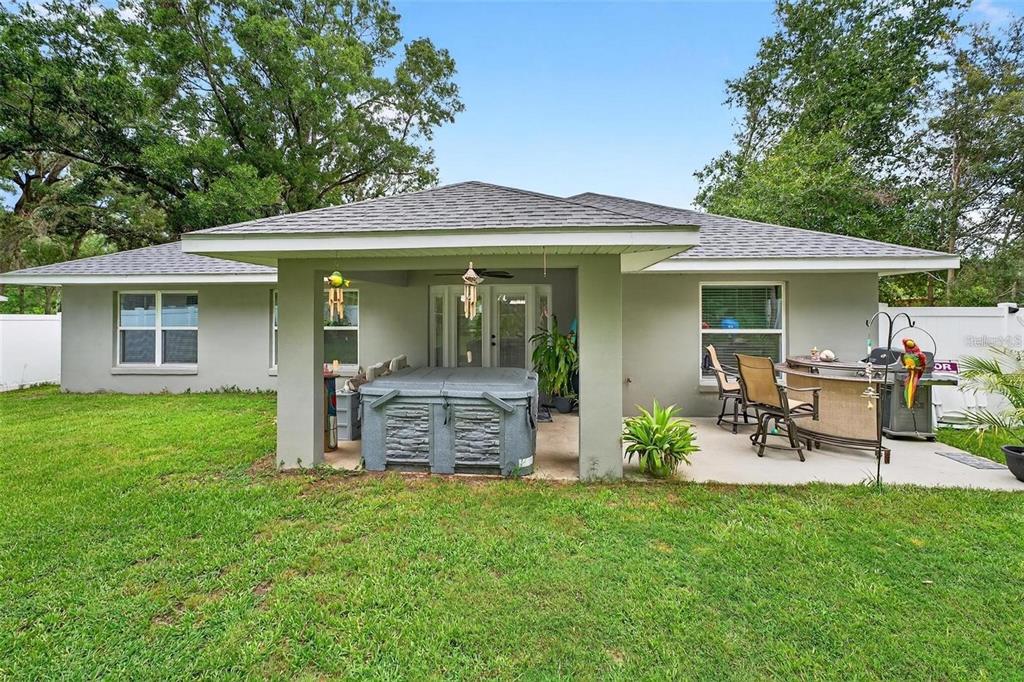 8160 Southeast 164th Place Summerfield, FL 34491 - Photo 45 of 56 a view of a chair and table in backyard of the house