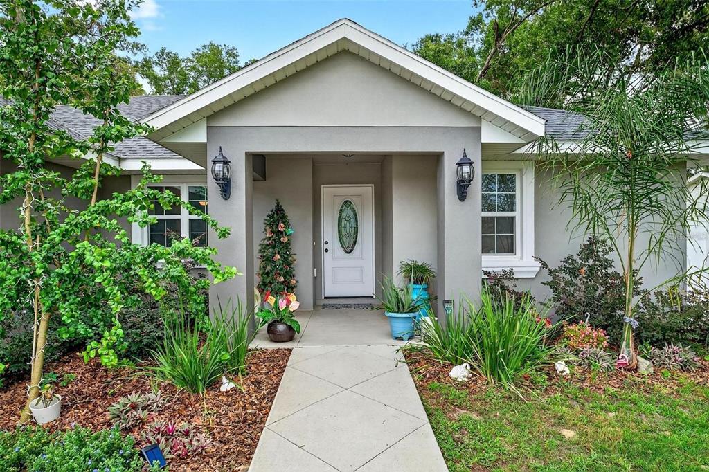 8160 Southeast 164th Place Summerfield, FL 34491 - Photo 55 of 56 a front view of a house with garden