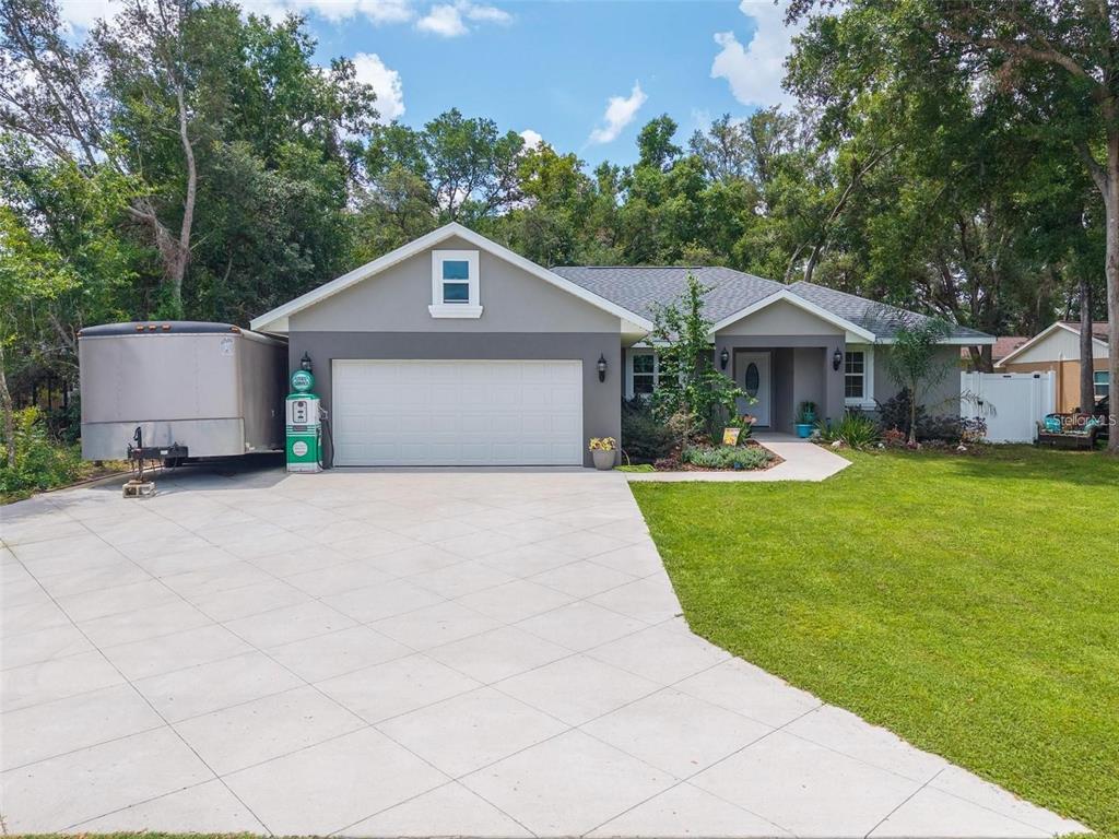 8160 Southeast 164th Place Summerfield, FL 34491 - Photo 56 of 56 a front view of a house with garden