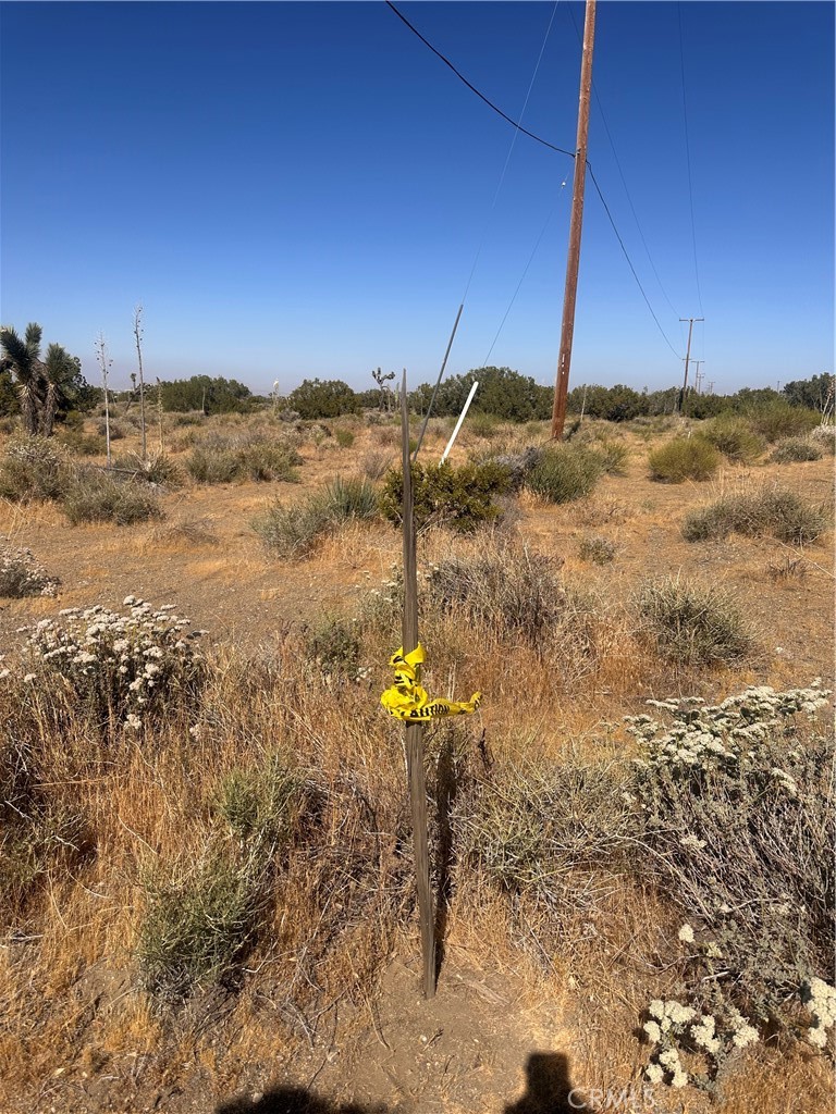 0 Coyote / Pionero Road Phelan, CA 92371 - Photo 6 of 13 Yellow Caution tape On stick on North West Corner . APPROXIMATE