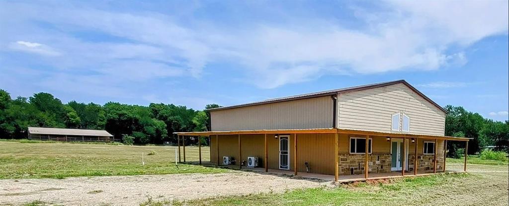 2191 Bethany Road Sherman, TX 75090 - Photo 1 of 14 a view of a house with a yard