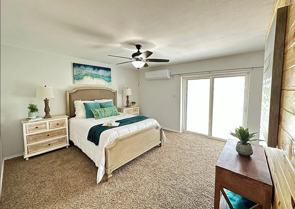 2191 Bethany Road Sherman, TX 75090 - Photo 12 of 14 a bedroom with a bed and a chandelier
