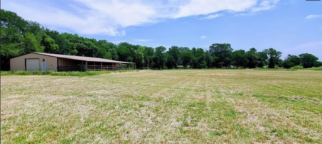 2191 Bethany Road Sherman, TX 75090 - Photo 13 of 14 a backyard of a house with lots of green space