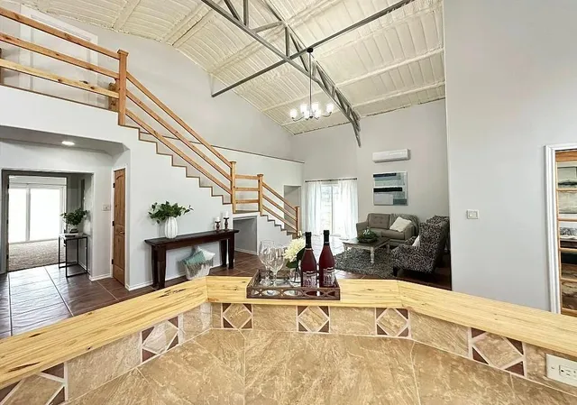 a view of a living room and dining room