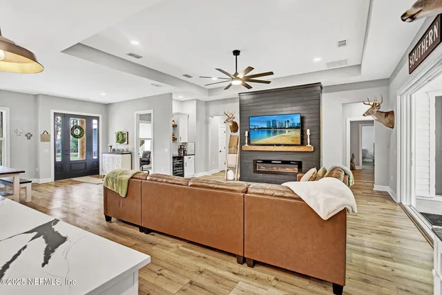 a living room with furniture and a flat screen tv