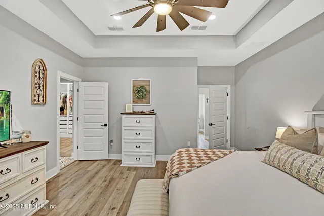 a bedroom with a bed and a dresser