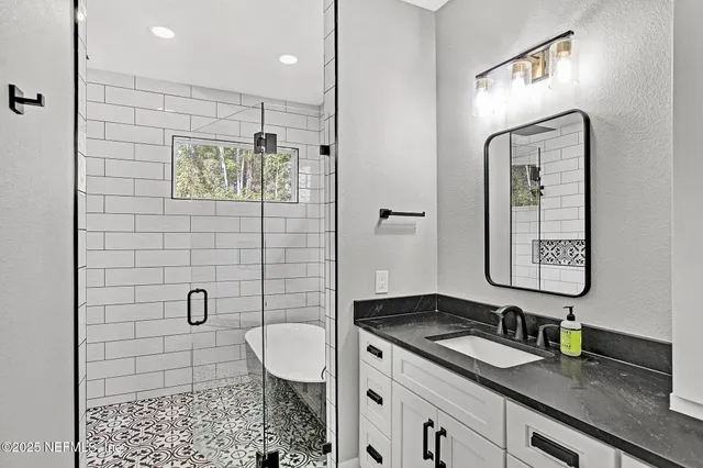 a bathroom with a sink a toilet and mirror