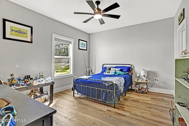 a bedroom with a bed and a table in it