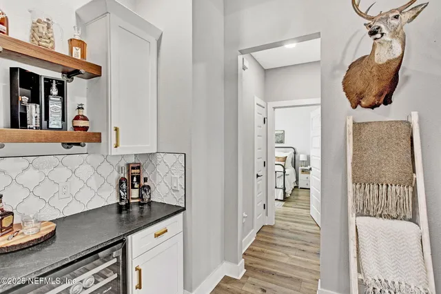 a bedroom with furniture and a window