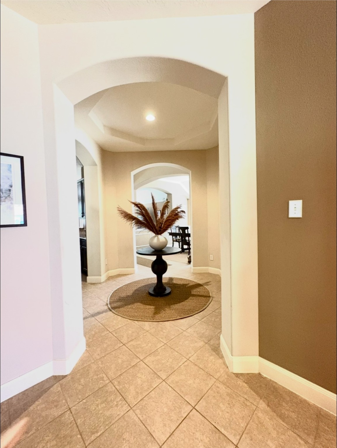 6315 Oakmont Creek Drive Spring, TX 77379 - Photo 13 of 16 a view of a hallway with a chandelier