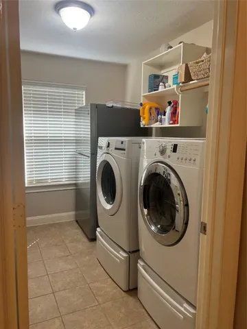 a utility room with dryer and washer