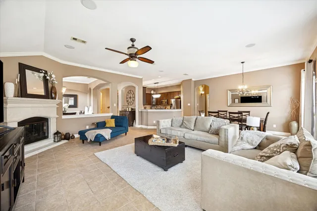 a living room with furniture gym equipment and a fireplace