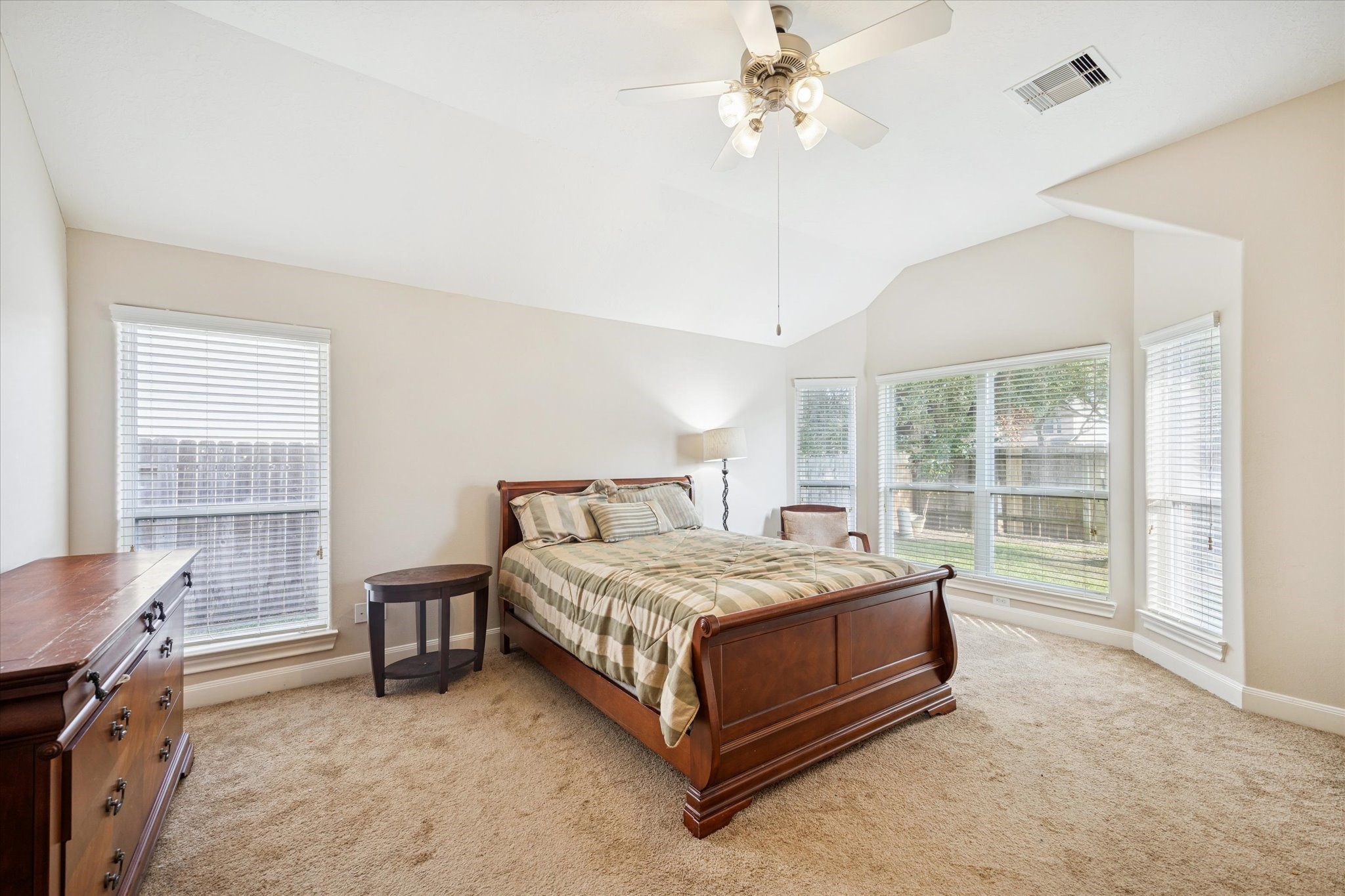 6315 Oakmont Creek Drive Spring, TX 77379 - Photo 8 of 16 a bed sitting in a bedroom next to a window