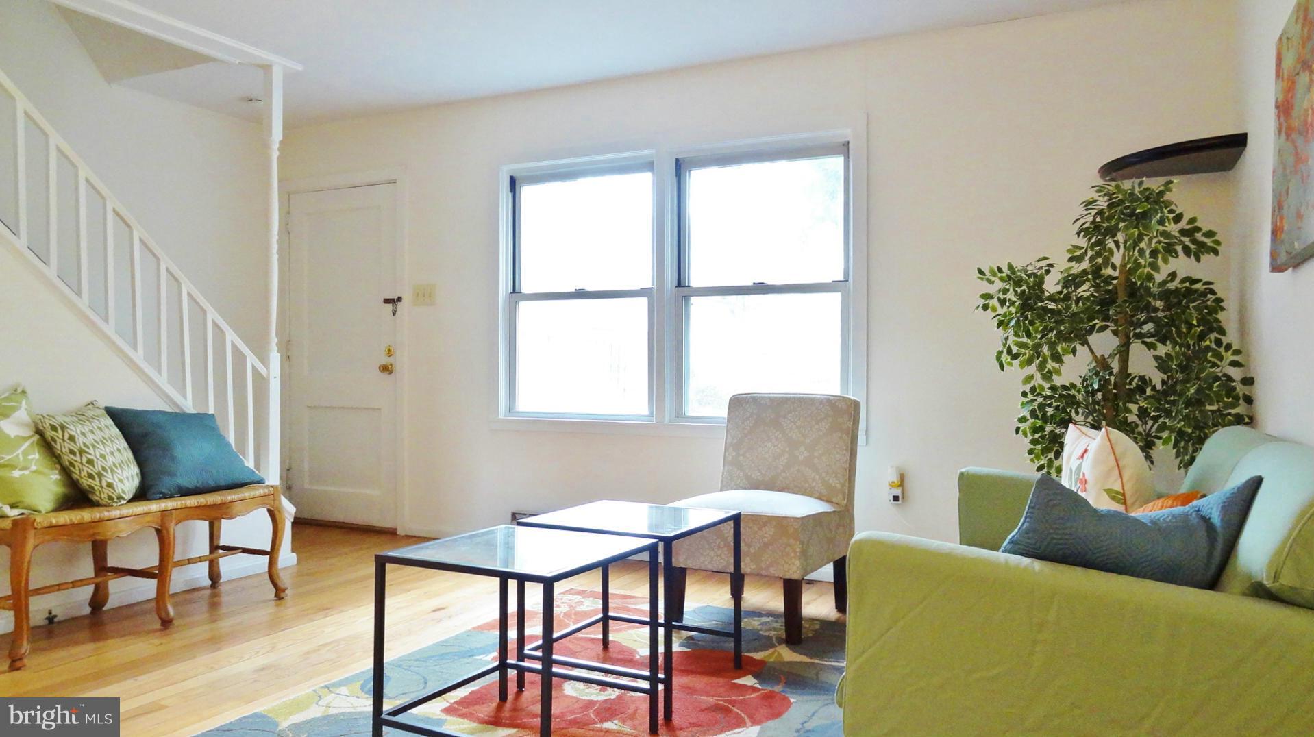 51 Ridge Road, Unit B Greenbelt, MD 20770 - Photo 5 of 8 a living room with furniture and a window