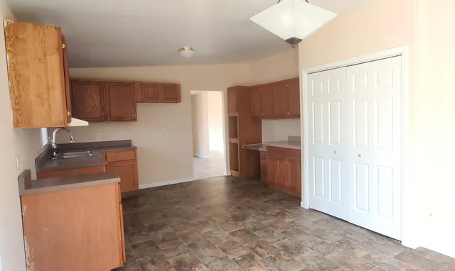 a kitchen with stainless steel appliances a refrigerator and a sink
