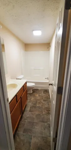 a bathroom with a sink and a bathtub