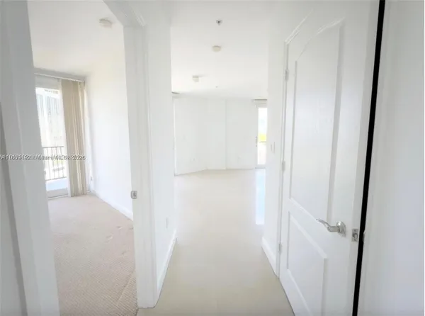 a view of a hallway with a white walls