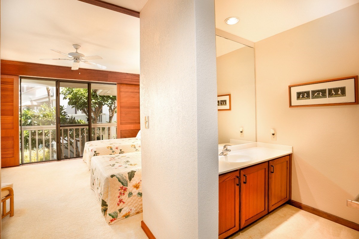 2221 Kapili Road, Unit 52 Koloa, HI 96756 - Photo 12 of 26 a view of a kitchen with a sink and large window