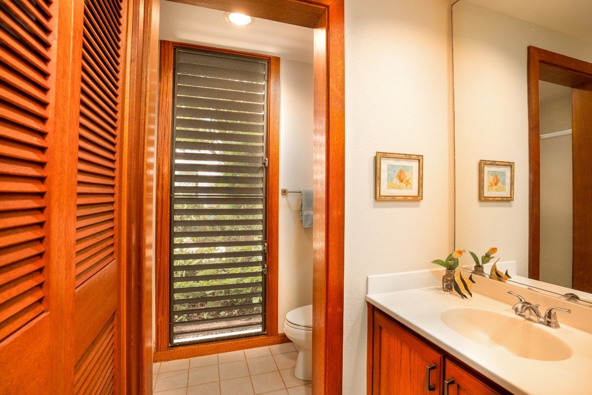 2221 Kapili Road, Unit 52 Koloa, HI 96756 - Photo 15 of 26 a bathroom with a sink and a mirror