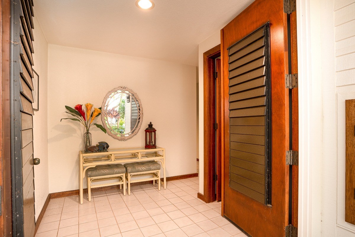 2221 Kapili Road, Unit 52 Koloa, HI 96756 - Photo 16 of 26 a chair and a table in a room